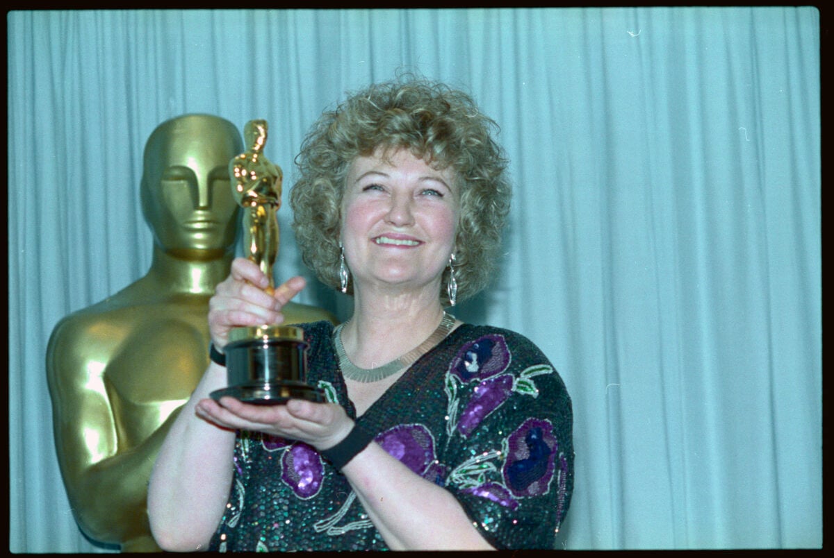 (Original Caption) Academy Awards, Los Angeles - Brenda Fricker holds up her Oscar after winning Best Supporting Actress for her role in My Left Foot March 26 at the 62nd Academy Awards.