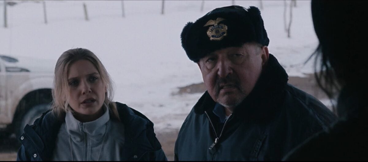 Elizabeth Olson and Graham Greene in Wind River (Photo Credit: Rotten Tomatoes / YouTube)