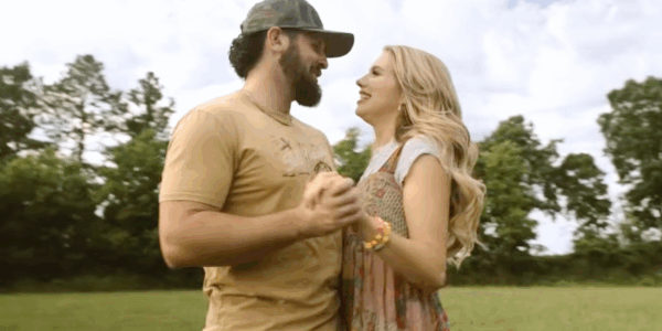 American Idol winner Hannah Harper and her husband Devon in the visualizer music video for her new song "Married Into This Town"