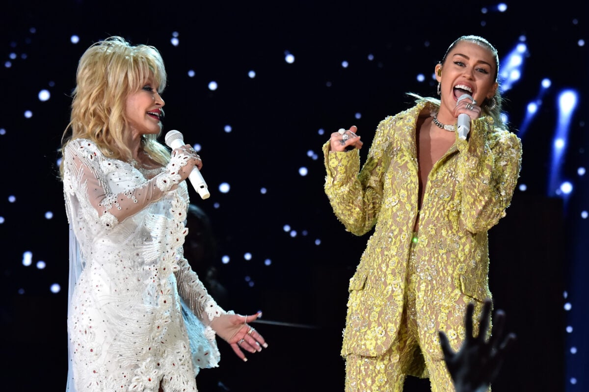 LOS ANGELES, CA - FEBRUARY 10:  Dolly Parton (L) and Miley Cyrus perform onstage during the 61st Annual GRAMMY Awards at Staples Center on February 10, 2019 in Los Angeles, California.