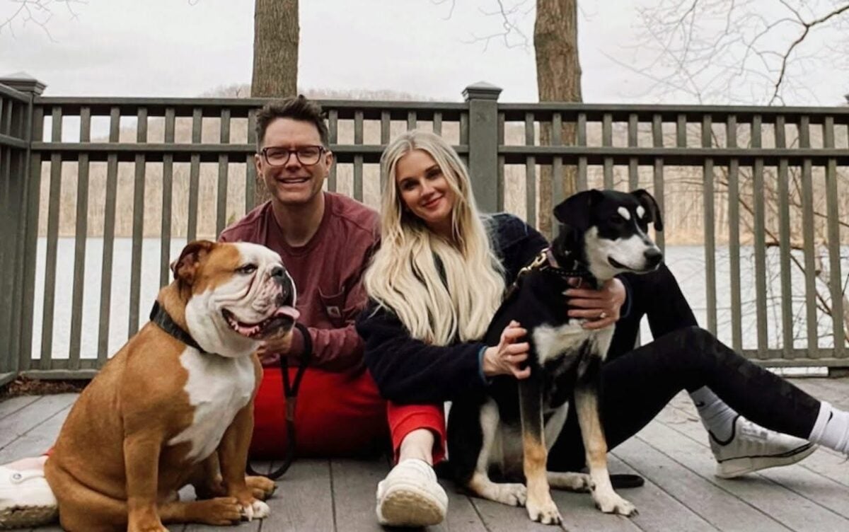 Bobby Bones and wife Caitlin with their dogs Stanley and Eller