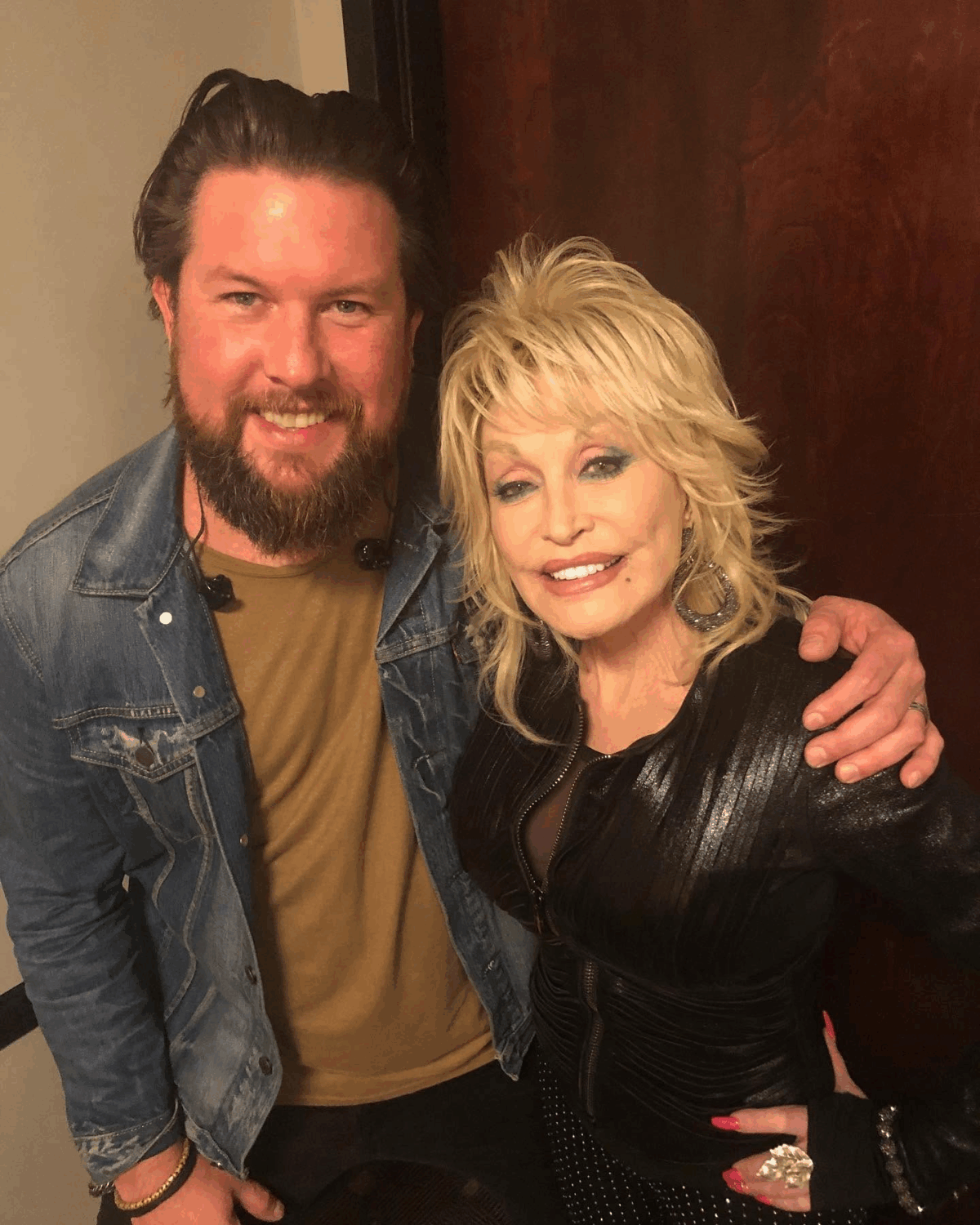 Zach Williams and Dolly Parton posing during rehearsals of "There Was Jesus" at the 2019 CMA Awards