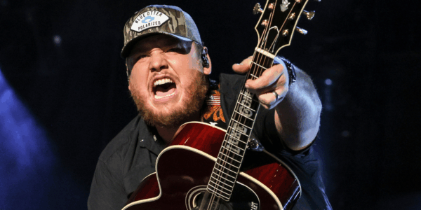 luke combs with a guitar