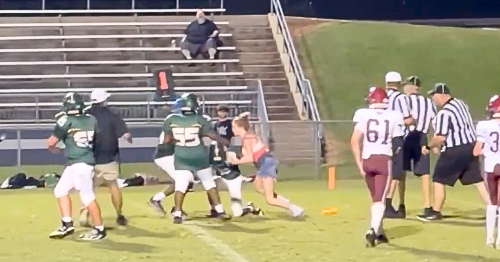 A 16-year-old girl was caught on video tackling a football player mid-game. She now faces charges, but claims she was defending her brother.