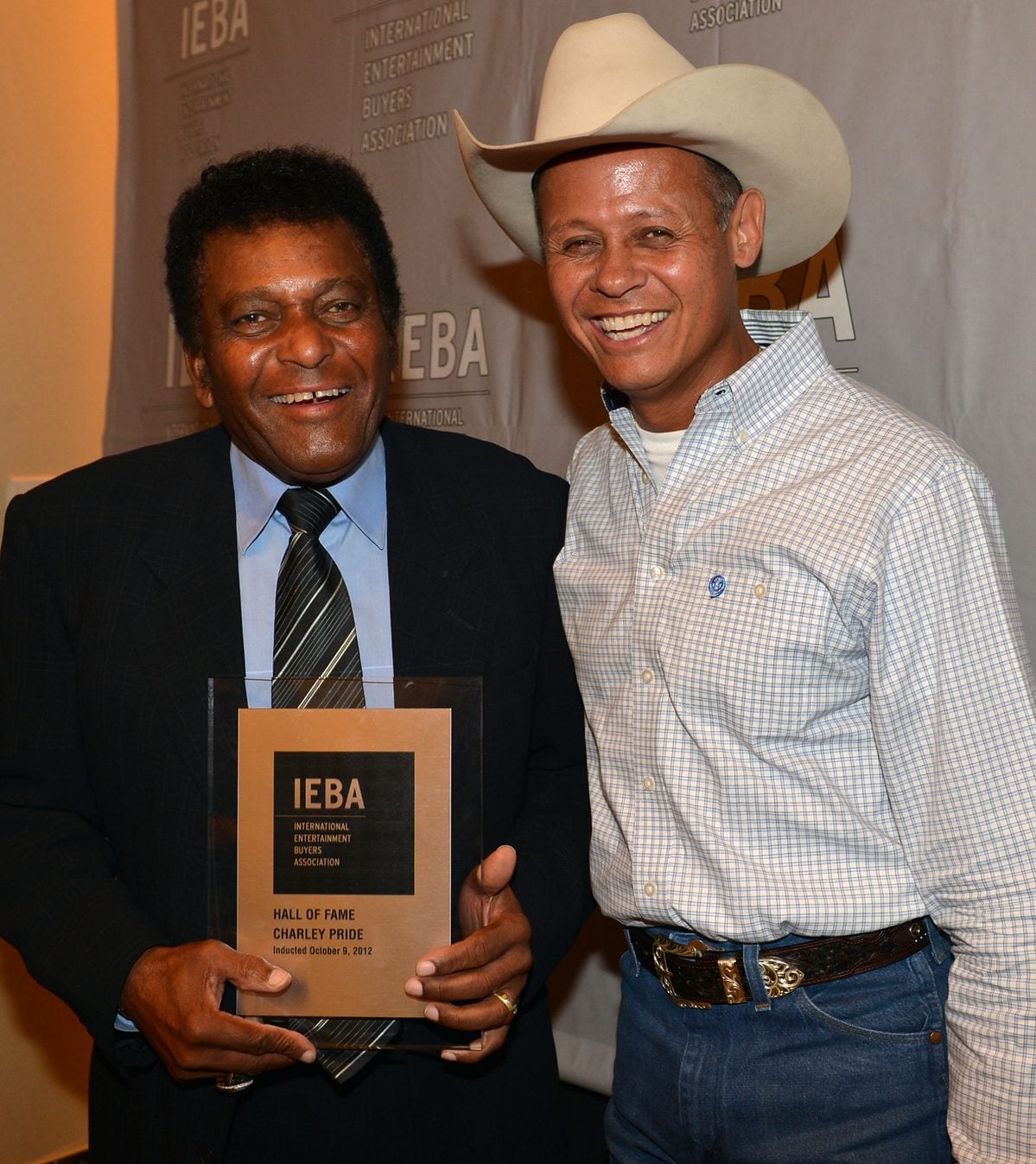 NASHVILLE, TN - OCTOBER 09:  Hall of Fame inductee Charley Pride and Neal McCoy pose backstage during the IEBA and CMA Present Hall of Fame and SRO Awards Dinner at IEBA Conference Day 3 at the Sheraton Nashville Downtown on October 9, 2012 in Nashville, Tennessee.  