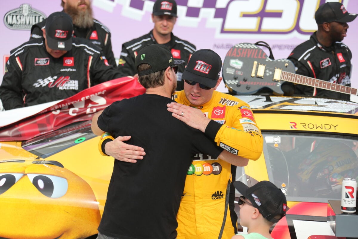 Kurt Busch and Kyle Busch brothers and NASCAR drivers hug in 2021