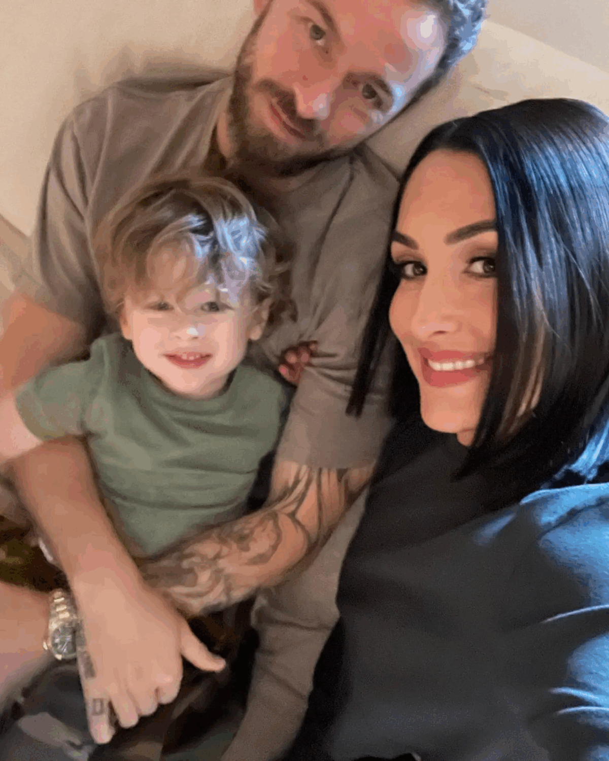 Artem Chigvintsev, Nikki Bella, and their son Mateo 