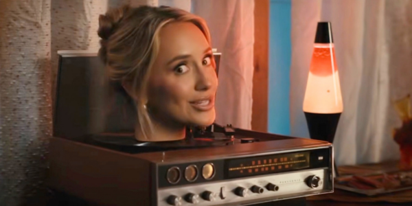 Lainey Wilson loses her head in quirky new music video for her song "Phone, Keys, Wallet," which features John Mayer on guitar