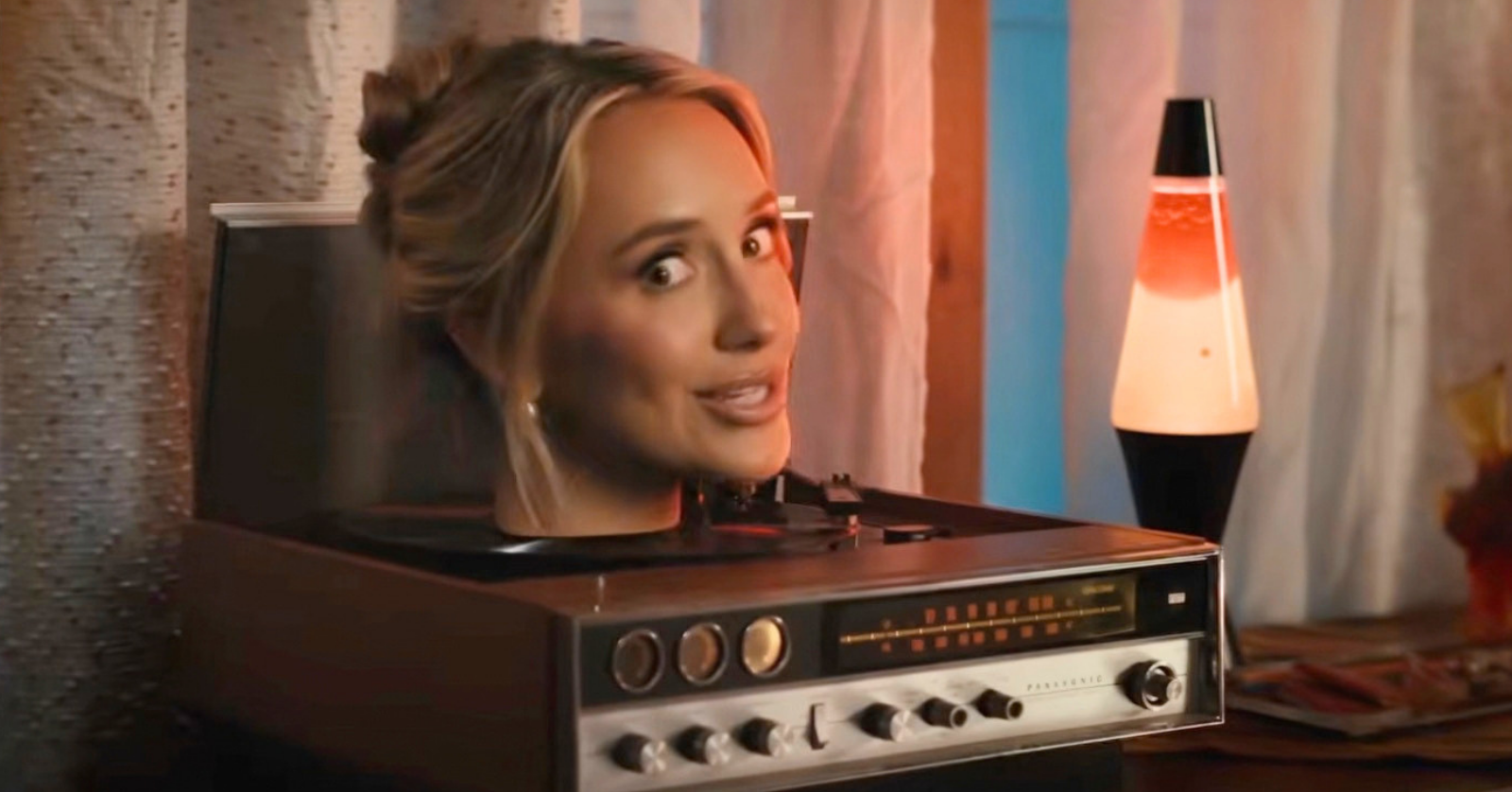 Lainey Wilson loses her head in quirky new music video for her song "Phone, Keys, Wallet," which features John Mayer on guitar
