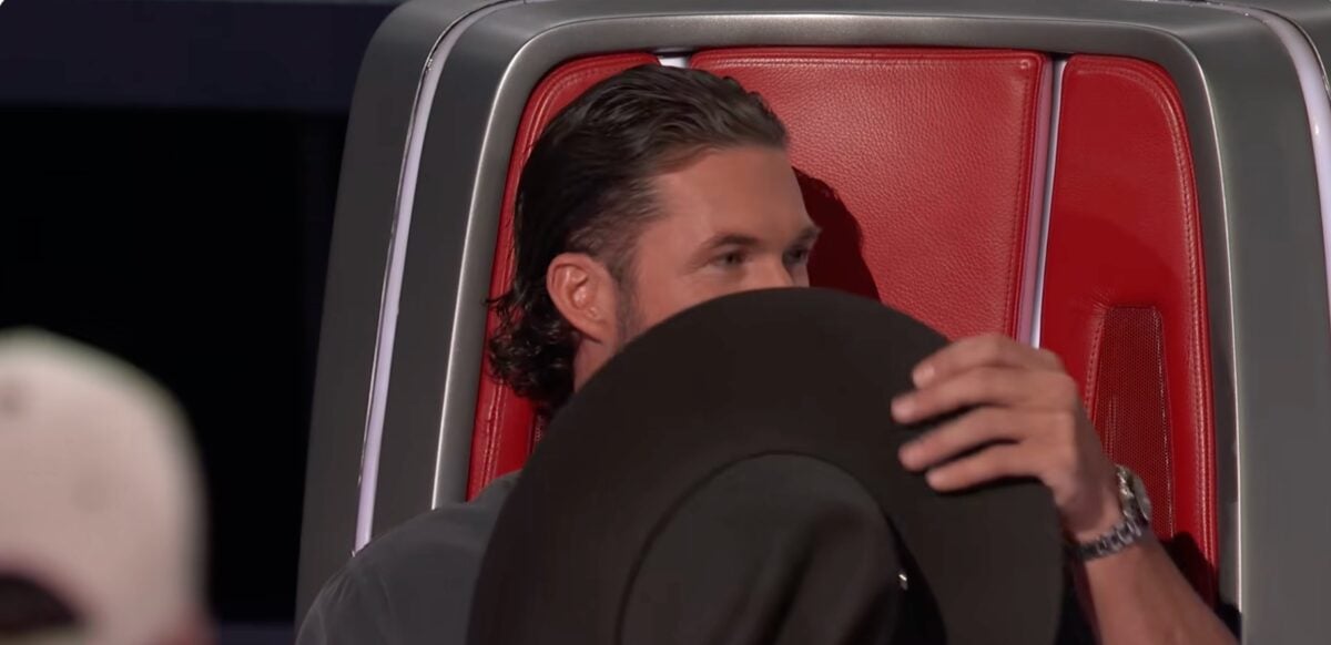 Riley Green hid behind his hat after Queen Latifah sang for a contestant she wanted to joined her team on The Voice, taking him from Riley