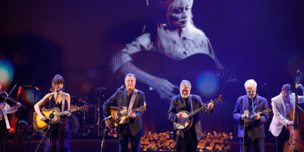 While the late Dolly Parton was known as the "Queen of Country," she also made a significant impact on folk music. Honoring that aspect of her career, artists Ricky Skaggs, Vince Gill, Molly Tuttle, and Béla Fleck were on hand for a special tribute performance.