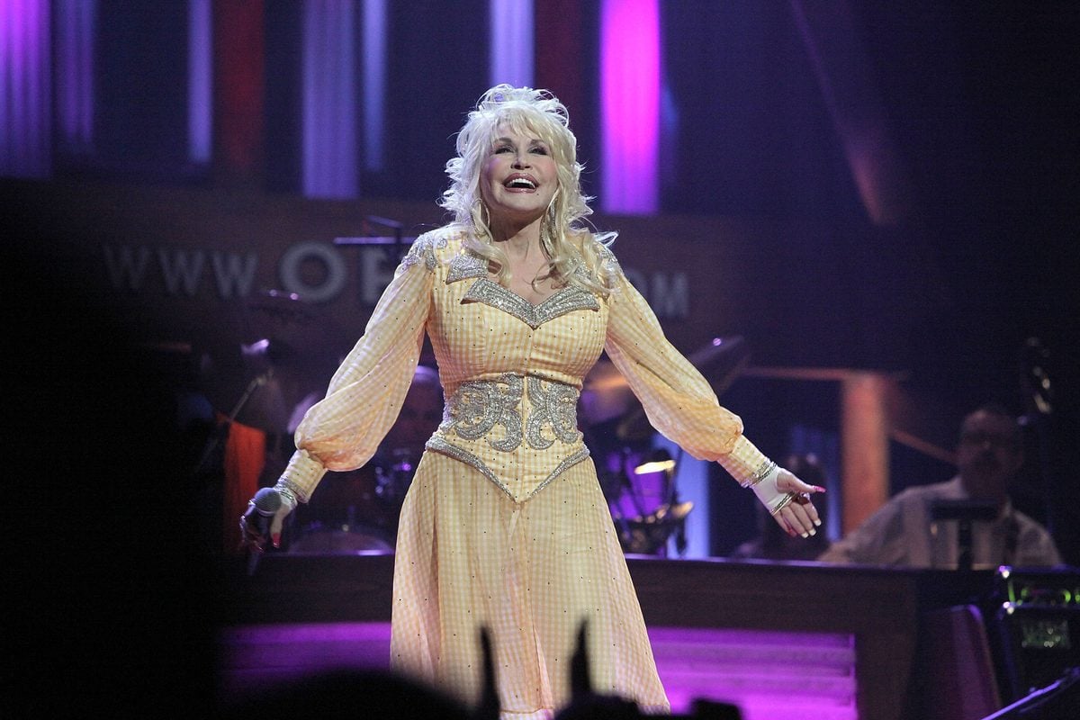 dolly parton on stage at the grand ole opry 