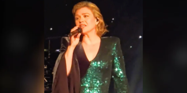 Kelly Clarkson stops her set in the middle of a song to help a fan