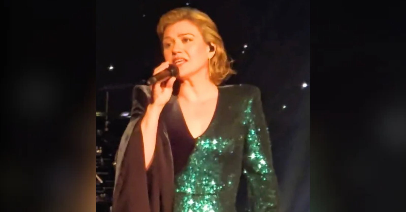 Kelly Clarkson stops her set in the middle of a song to help a fan