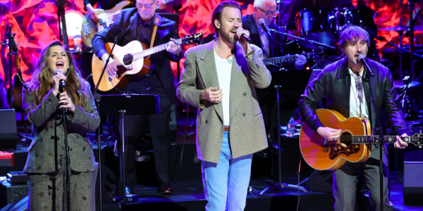 Lady A members Hillary Scott, Charles Kelley, and Dave Haywood perform "Live Like You Were Dying" at the 2026 Country Music Hall of Fame Medallion Induction Ceremony in honor of inductee Tim McGraw, amid Charles Kelley's battle with a rare form of blood cancer
