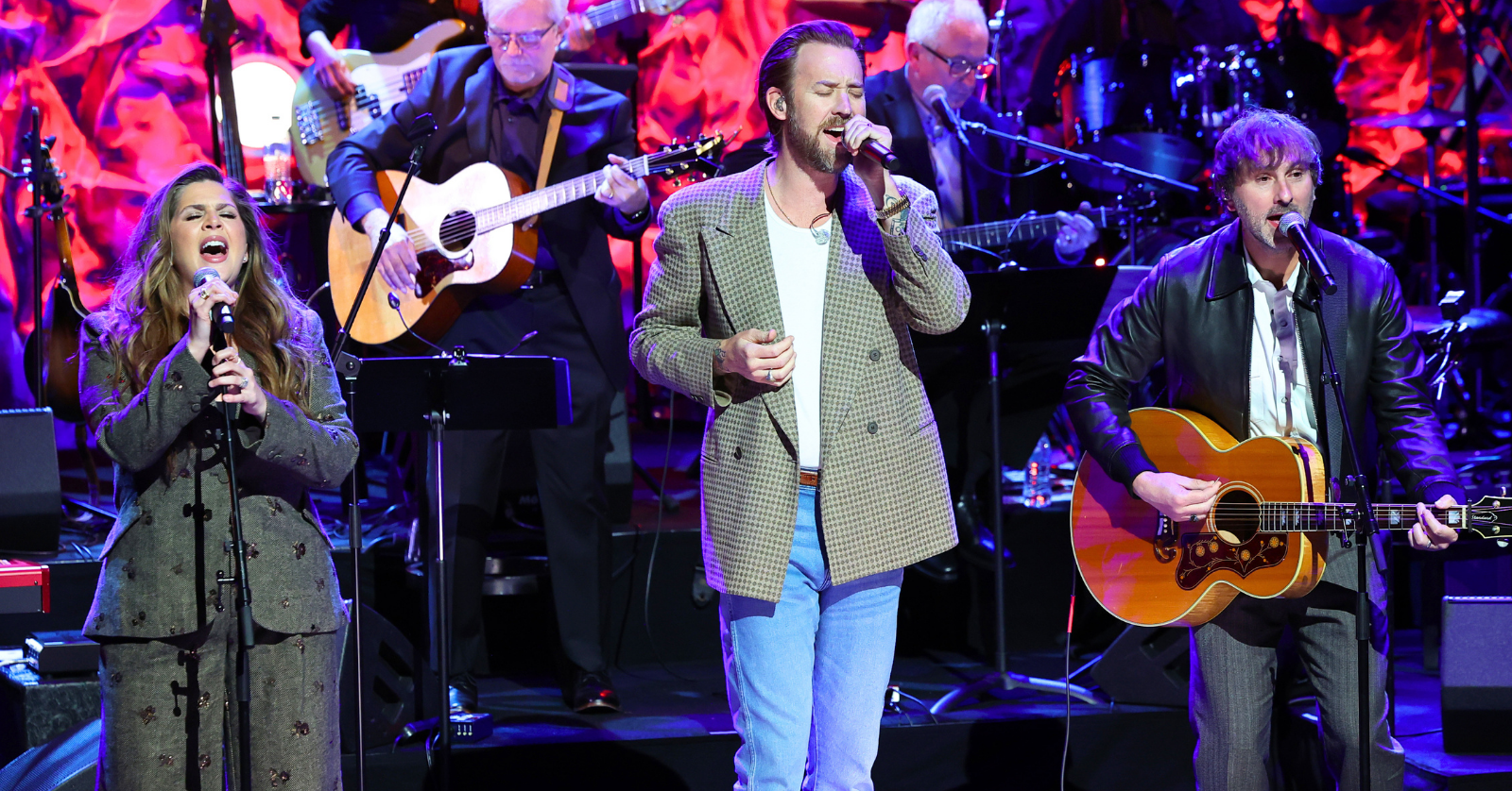 Lady A members Hillary Scott, Charles Kelley, and Dave Haywood perform "Live Like You Were Dying" at the 2026 Country Music Hall of Fame Medallion Induction Ceremony in honor of inductee Tim McGraw, amid Charles Kelley's battle with a rare form of blood cancer